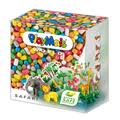 A colourful PlayMais Safari craft kit box features small, multicoloured corn-based pieces. The packaging shows playful animal creations such as an elephant and lion, with green foliage, and the label displays the brand name and “Safari” prominently on the front.