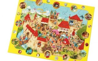 A colourful cartoon puzzle depicts a lively medieval village scene with castles, villagers, and animals. The yellow border features small circular images highlighting individual characters and activities from the main illustration. The puzzle is partially assembled.