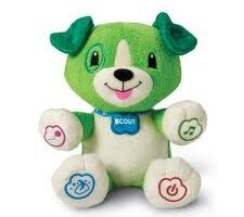A plush green and white dog toy with a blue collar labelled "SCOUT." The dog has floppy green ears, a smiling face, and colourful icons on its paws, including a heart, music note, cloud, and power symbol, indicating interactive features.