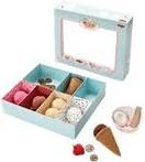A pastel blue box with compartments displays toy ice cream scoops, cones, biscuits, and other dessert-themed play items. The box lid is open and placed behind, while toy treats and cones are arranged in front of the box.