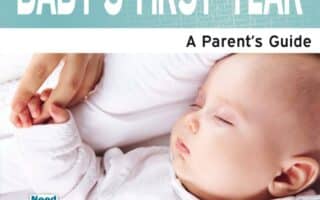 A sleeping baby in a white babygrow lies on a bed, gently holding an adult’s finger. The cover reads “BABY'S FIRST YEAR: A Parent’s Guide” and credits Shanta Everington as the author. The design is soft, with blue and white tones.