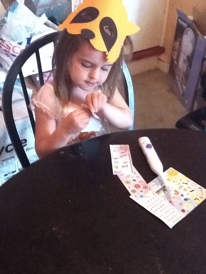 A girl sitting at a table.