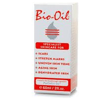 A white box of Bio-Oil with red text. The label lists uses: scars, stretch marks, uneven skin tone, ageing skin, and dehydrated skin. The front also displays the Bio-Oil logo, a striped oil drop graphic, and the product size: 60ml / 2 fl. oz.