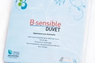 A package labelled “B.sensible DUVET” in red and black text on a white background with light blue floral designs. The packaging also features a blue and green logo, health and quality certification icons, and descriptive product information in English.