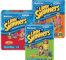 Three packs of Huggies Little Swimmers disposable swim nappies in red, blue, and green packaging. Each pack shows children playing in swimwear, with the Huggies Little Swimmers logo and size and quantity information visible on each pack.