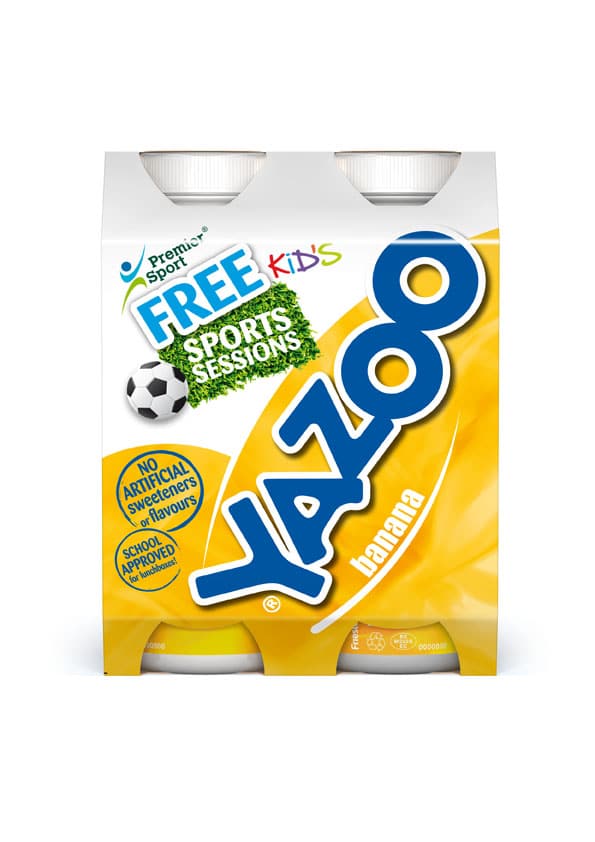 A four-pack of Yazoo banana milk drink in yellow packaging. The label features a large blue Yazoo logo, a football, “FREE KIDS SPORTS SESSIONS,” and notes about no artificial sweeteners or flavours and school approval.