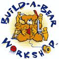 A brown teddy bear holding a red heart sits surrounded by yellow bear-making tools. Blue text in a playful font circles around the bear, reading "BUILD-A-BEAR WORKSHOP," with a red button and yellow reel accenting the letters.