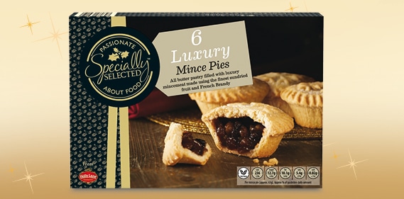 A box of “Specially Selected” 6 Luxury Mince Pies is shown. The packaging features an image of golden pastry pies, one cut open to reveal rich, dark fruit filling. There are logos for quality and dietary icons along the bottom of the box.