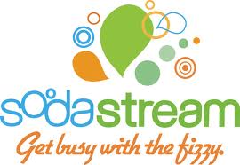 SodaStream logo with colourful bubbles and leaf shapes above “sodastream” in blue and green text. Below, “Get busy with the fizzy.” is written in orange cursive. The design evokes freshness and carbonation.