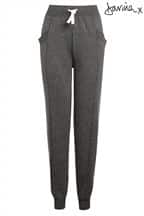 Dark grey, high-waisted joggers with a white drawcord, elasticated waistband, and cuffed ankles. The trousers feature side pockets and a relaxed fit. The brand name, "Janina," is displayed in black script in the upper right corner.