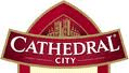 The image shows the Cathedral City cheese logo, featuring the words "CATHEDRAL CITY" in bold white letters on a red background with an illustration of a cathedral above the text. The design is outlined in gold with a pointed arch shape.