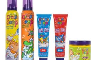 Five colourful kids’ bath products labelled "Crazy Soap" are shown: two tall foam soap bottles (orange/yellow, green/purple), two tubes of bathtime body paint (red, blue), and a yellow-lidded jar. All have playful cartoon animal illustrations.