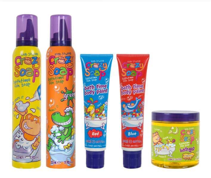 Five colourful kids’ bath products labelled "Crazy Soap" are shown: two tall foam soap bottles (orange/yellow, green/purple), two tubes of bathtime body paint (red, blue), and a yellow-lidded jar. All have playful cartoon animal illustrations.