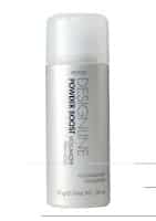 A silver cylindrical bottle of Regis Designline Powder Boost Volumiser for hair, with a white translucent cap. The label features bold black and grey text detailing the product name and volume, 15 grams (0.53 oz).