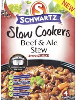 A packet of Schwartz Slow Cookers Beef & Ale Stew Recipe Mix is shown. The packaging displays a photo of hearty beef stew with carrots and herbs, text highlighting it serves four, and a small icon of a slow cooker. “NEW” is seen in the top right corner.