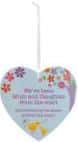 A heart-shaped lavender-blue air freshener with colourful flowers and a hanging string. The text reads: “Dear car owners: Driving whilst thinking about something else causes most accidents.”.