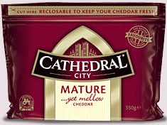 A maroon and cream packet of Cathedral City Mature Cheddar cheese, labelled “Mature ...yet mellow” and weighing 350g. The packaging is resealable and features a gold castle logo and the phrase “RESEALABLE TO KEEP YOUR CHEDDAR FRESH.”.