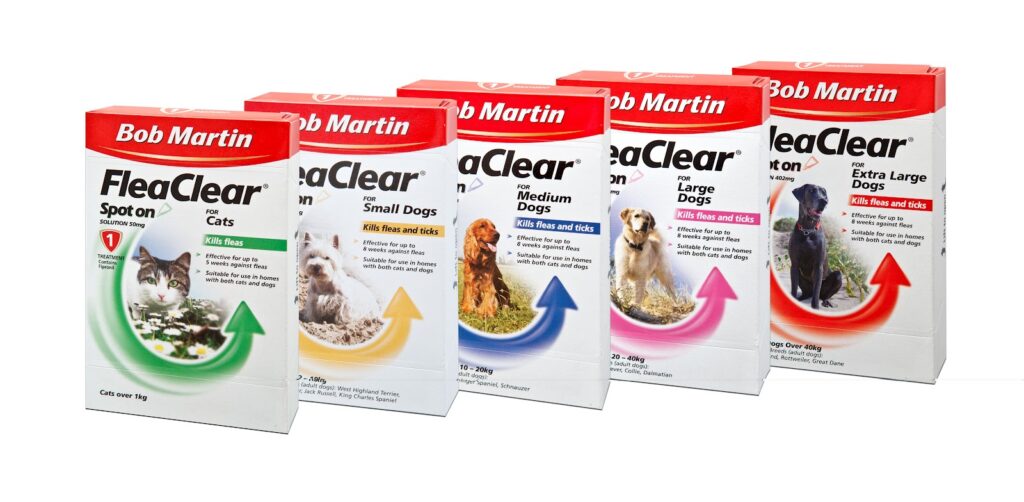 Five boxes of Bob Martin FleaClear spot-on treatments are lined up. Each box is for a different pet: cats, small dogs, medium dogs, large dogs, and extra large dogs. The boxes are mainly white and red, each with a pet photo and coloured arrow.