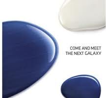 Three glossy, paint-like blobs—one dark blue, one white, and one blue—are arranged on a white background. The text “COME AND MEET THE NEXT GALAXY” appears next to the blobs, suggesting an invitation to a Samsung Galaxy event.