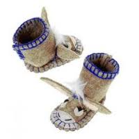 A pair of felt baby bootees designed to look like donkeys, featuring floppy ears, expressive eyes, and heart-shaped noses. The bootees are beige with purple stitching around the top and have a small white feather accent on each.