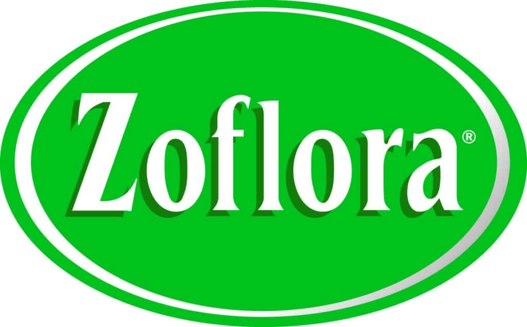 A green oval logo with a white border features the word "Zoflora" in large, white, bold serif letters. A small registered trade mark symbol appears at the upper right of the text. The background is solid green with a slight shadow effect.