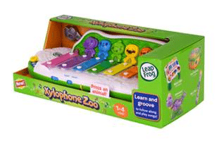 A green LeapFrog Xylophone Zoo toy box displays a colourful xylophone with five rainbow-coloured keys, each topped with an animal figure. The packaging shows musical notes and advertises learning, music, and animal sounds for ages 1–4.