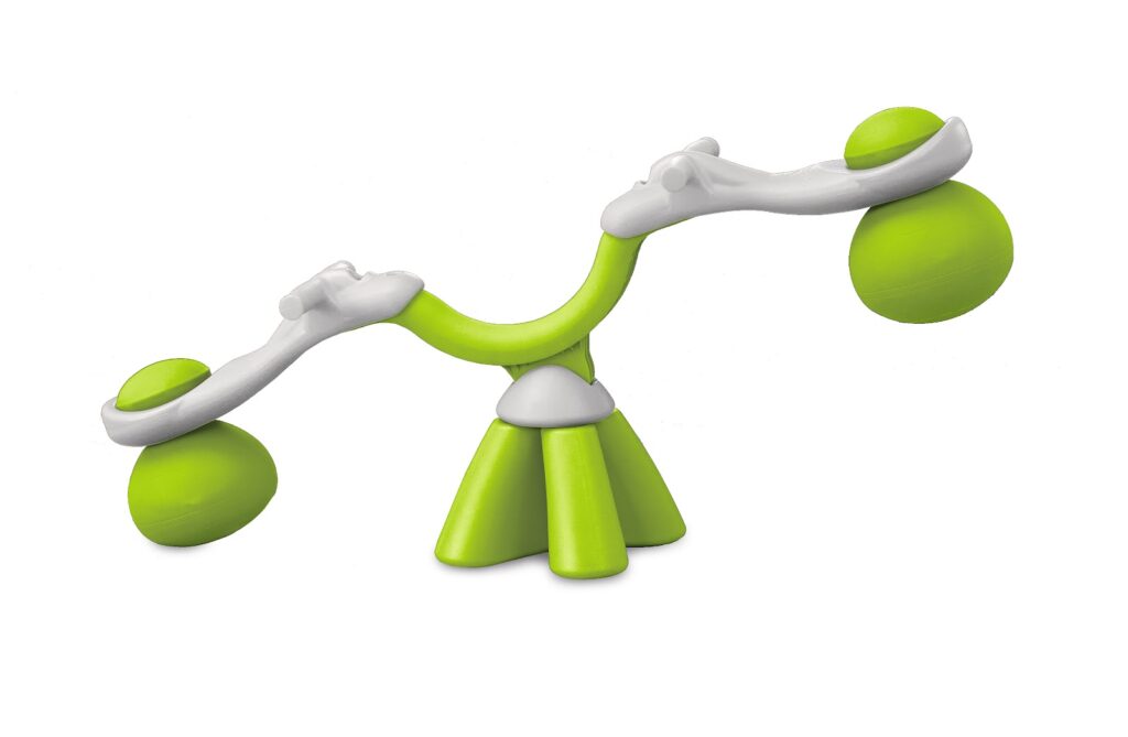 A modern, abstract green and white seesaw with rounded seats and handles, featuring three legs and two upward-curving arms. The design is playful and minimalistic, set against a plain white background.