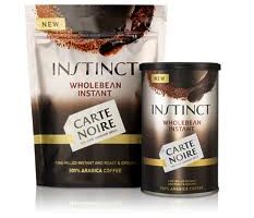 Two containers of Carte Noire Instinct Wholebean Instant Coffee are shown: a stand-up pouch and a cylindrical jar. Both have a brown and gold design, with the product name in bold letters and “100% Arabica Coffee” text at the bottom.