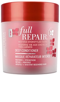 A red and pink jar labelled "Full Repair Deep Conditioner" by John Frieda. The text highlights that it revives overstyled, damaged hair and restores, strengthens, and repairs. The lid is a deep red, and the container has both English and French text.