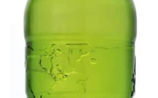 A green glass bottle of EQUATOR beer flavour drink with a silver label displaying "0.00% ALCOHOL, 0 CALORIES". The bottle is unopened with a silver cap, and the label features a modern, grid-like design. The background is white.