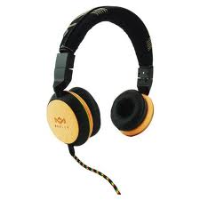 A pair of on-ear headphones featuring soft black ear cushions with round wooden outer ear cups. The headband is black with some yellow accents. A colourful, braided audio cable extends from the left ear cup. The headphones are shown on a white background.