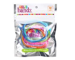A shiny plastic packet labelled "Multi Bandz" contains 12 colourful silicone wristbands. The bands are assorted bright colours, visible through the clear section of the packaging. The top and sides of the packet are silver.