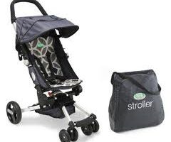 A lightweight, foldable pushchair with a geometric-patterned seat and a sun canopy, shown next to its compact carrying bag labelled “pushchair.” The pushchair has three double wheels and a black, silver, and grey colour scheme.