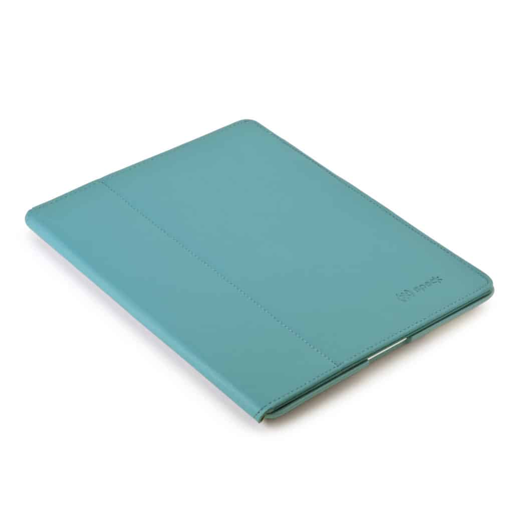 A turquoise tablet case lies closed on a white background. The case has a smooth, sleek texture with a visible seam running vertically near the left edge and a small embossed logo on the lower right corner. The case covers the device completely.