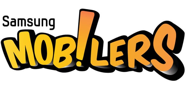 The image shows the "Samsung Mob!lers" logo. "Samsung" is in black, thin font, whilst "MOB!LERS" is bold, yellow with a black outline. The exclamation mark in "MOB!LERS" replaces the “I” and is orange, standing out in the centre of the word.