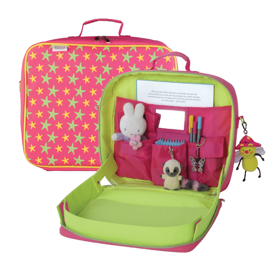 Open pink and green travel desk for children with star pattern. Inside are pockets holding a Miffy toy, a small plush mouse, pens, a butterfly clip, a notepad, and a comb. A smiley bee keyring hangs from the outside handle.