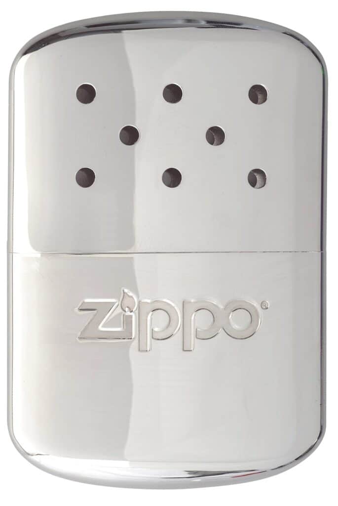 A shiny, silver rectangular Zippo hand warmer with rounded edges. The top section has eight small ventilation holes arranged in a pattern, and the bottom section features the embossed "Zippo" logo. The surface is reflective and metallic.