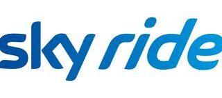 The image shows the words "sky ride" in lowercase, rounded blue letters with a gradient from dark to light blue, on a white background. The text appears italicised, slanting slightly to the right, giving a sense of movement.