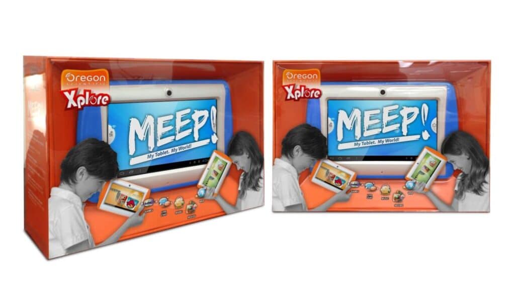 Two orange boxes of Oregon Xplore MEEP! tablets are shown. Each box features a large image of the tablet on the front, with a child using the device and various app icons below. The background is white and orange, and the packaging is displayed at an angle.