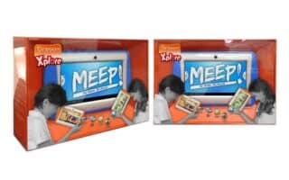 Two orange boxes of Oregon Xplore MEEP! tablets are shown. Each box features a large image of the tablet on the front, with a child using the device and various app icons below. The background is white and orange, and the packaging is displayed at an angle.