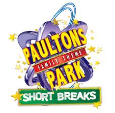 Colourful logo for Paultons Park Family Theme Park. The text is bold and yellow, with “FAMILY THEME” in red. Blue and purple swirls and yellow stars surround the logo. A green sign at the bottom reads “SHORT BREAKS” in white letters.