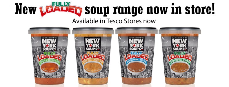 Four tubs of New York Soup Co. “Fully Loaded” soup are lined up in front of a white background. Text above reads: “New FULLY LOADED soup range now in store! Available in Tesco stores now.” Each tub displays a different soup flavour.