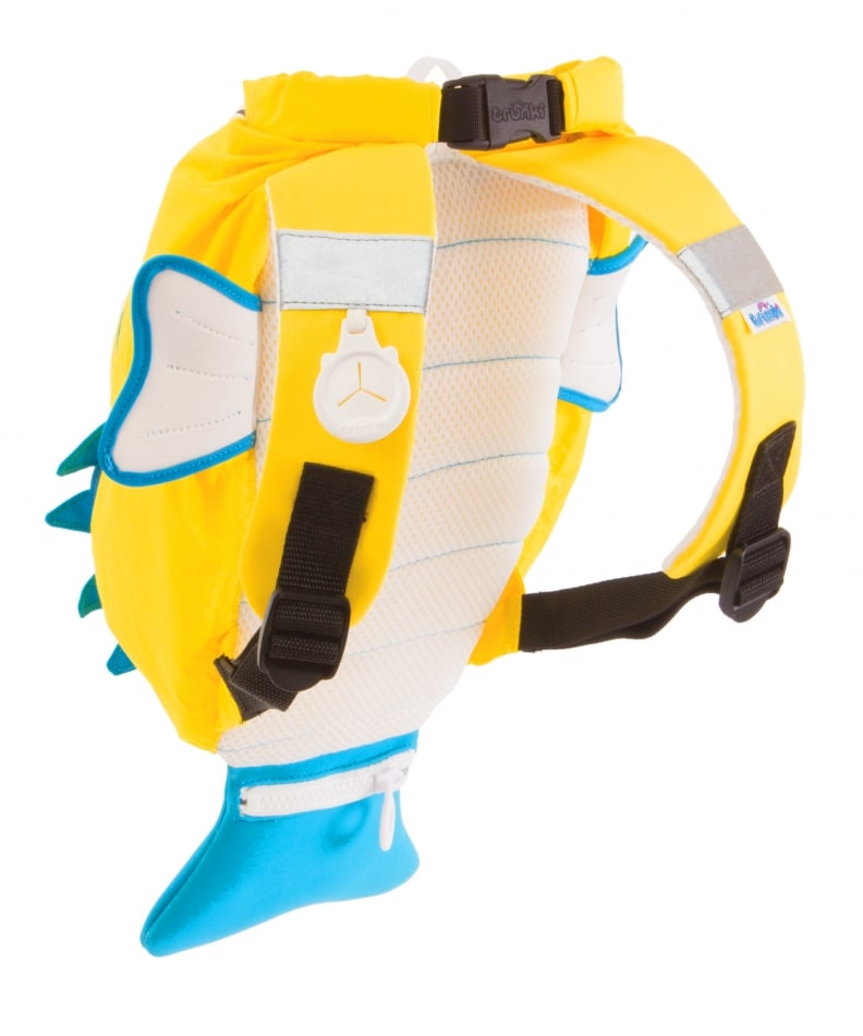 A bright yellow children’s rucksack shaped like a fish, with blue fins and tail, white mesh back, silver reflective strips, and black adjustable straps. The side features white flippers outlined in blue and a round white clasp shaped like a star.