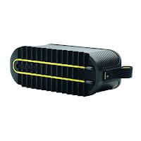 A compact, rectangular black portable speaker with a textured grille front, accented by two horizontal yellow lines and a side strap handle. The brand name "Anker" is visible on the front grille. The speaker has a rugged, modern design.