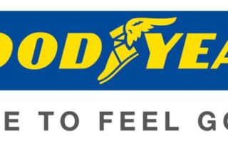 Goodyear logo with bold yellow text on a blue background. The winged foot symbol appears between “GOOD” and “YEAR.” Below, grey text reads “MADE TO FEEL GOOD.” on a white background.