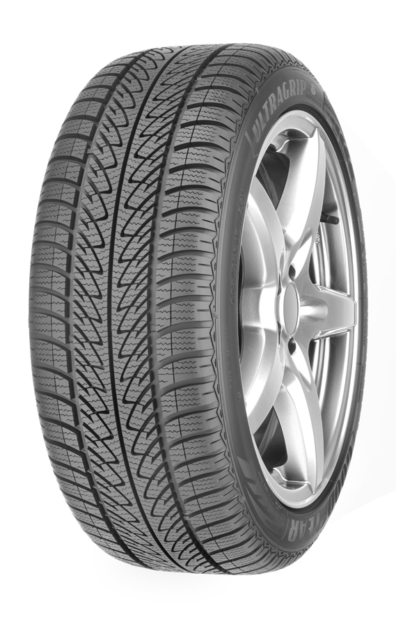 A close-up view of a black car tyre mounted on a silver alloy wheel, shown at an angle. The tyre has a detailed tread pattern with multiple grooves and zigzag sipes, and "UltraGrip" is visible on the sidewall. The background is plain white.
