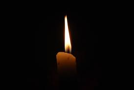 A candle with a flame.