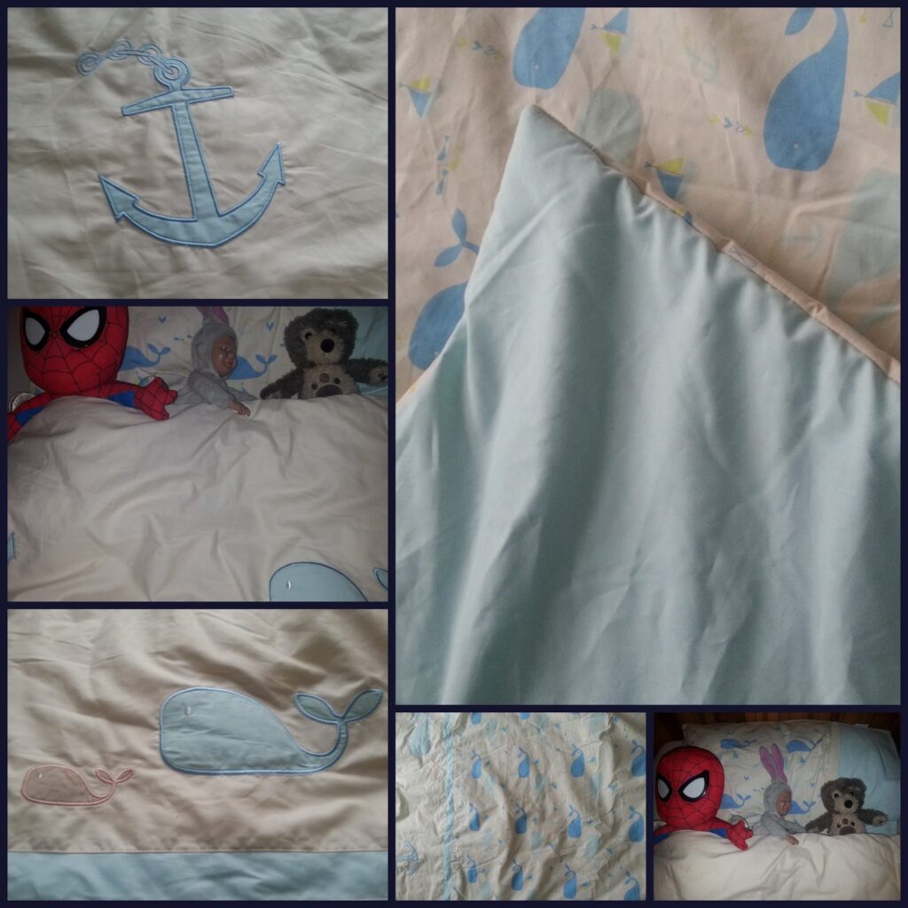 A collage of six photos shows a nautical-themed bedding set: an anchor, blue whales, and a pink whale are stitched or printed on fabric. Two images feature soft toys (a red superhero, a bear, and a bunny) tucked under the bedding.