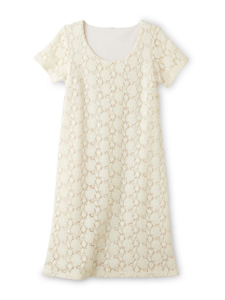 Short-sleeved, cream-coloured dress with a scoop neckline. The dress features an all-over floral lace pattern overlay on a solid lining, giving it a delicate, feminine look. The silhouette is straight and simple, with a knee-length hem.