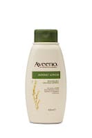 A beige plastic bottle of Aveeno Daily Moisturising Lotion with a green flip-top cap. The label displays the Aveeno logo, product name, and an image of oat grains, indicating the lotion’s key ingredient. The background is plain and white.